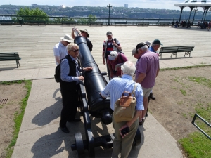 Group examining a gun on Terrace Dufferin