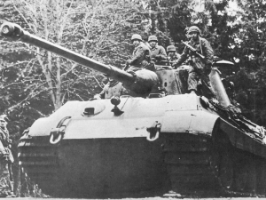 Tiger II advances through the forested Ardennes Hills