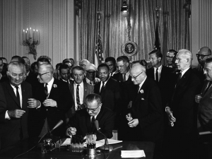 Lyndon B. Johnson signs the Civil Rights Act of 1964